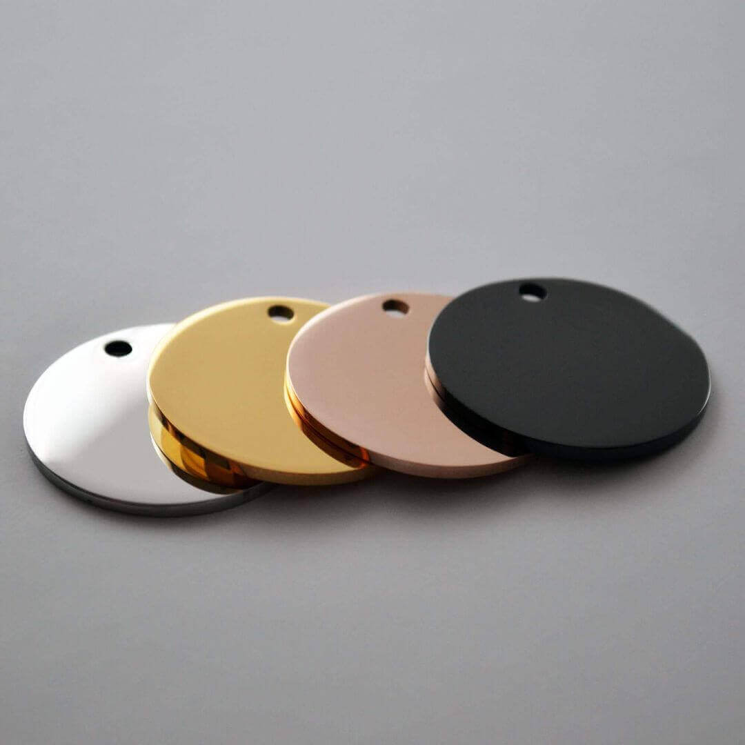 Blank round metal pet ID tags in silver, gold, rose gold, and black — customizable dog and cat name tags for engraving.
