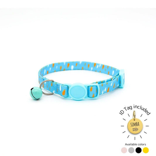 Nature-themed cat collar with blue buckle and bell includes personalized ID tag.