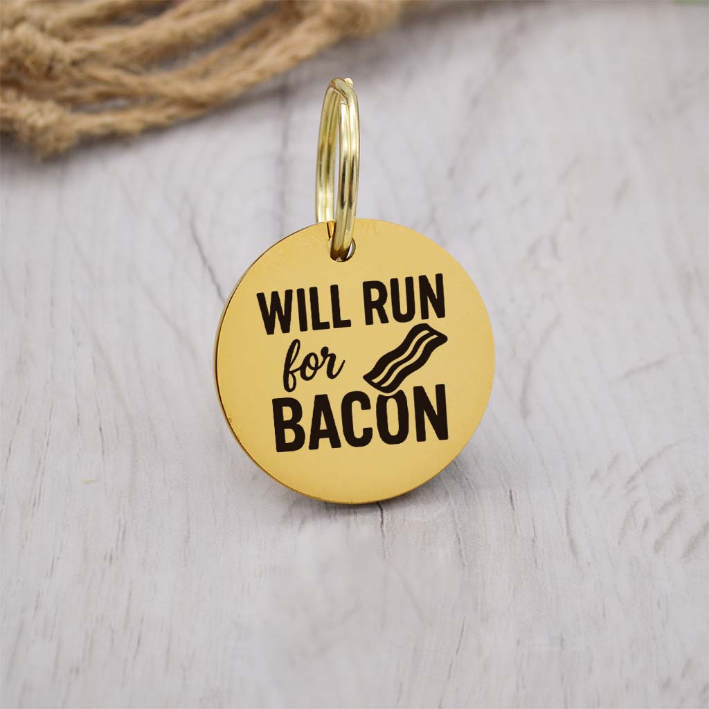Funny gold pet ID tag with 'Will Run For Bacon' engraved — personalized dog or cat tag for pet safety and identification.
