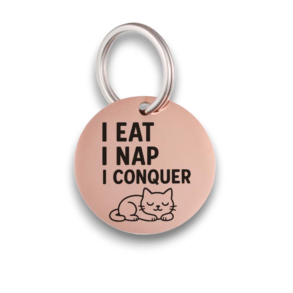 Funny rose gold pet ID tag for dogs and cats with the engraved text 'I eat I nap I conquer' - Tag4MyPet