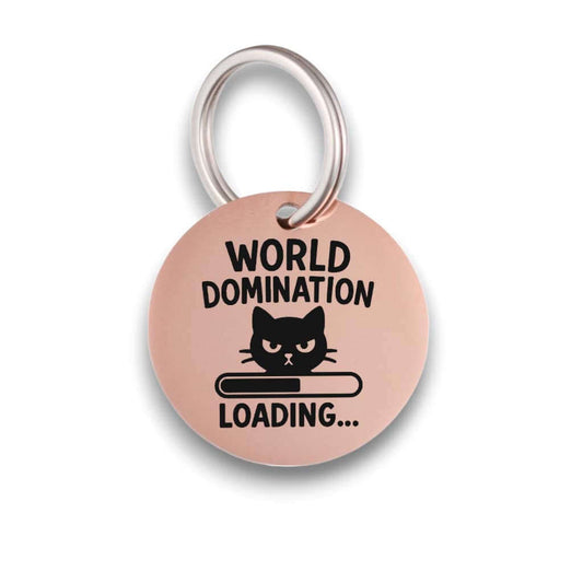 Funny rose gold pet ID tag for dogs and cats with the engraved text 'World Domination' - Tag4MyPet