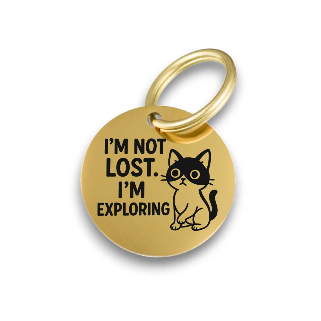 Funny gold pet ID tag for dogs and cats with the engraved text 'I'm Not Lost.I'm Exploring' - Tag4MyPet