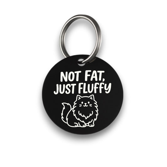 Funny black pet ID tag for dogs and cats with the engraved text 'Not Fat, Just Fluffy' - Tag4MyPet