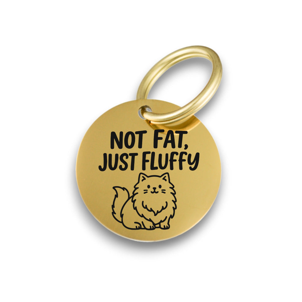 Funny gold pet ID tag for dogs and cats with the engraved text 'Not Fat, Just Fluffy' - Tag4MyPet