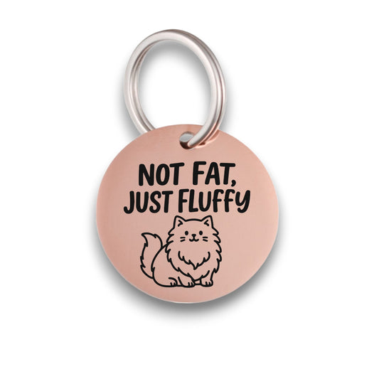 Funny rose gold pet ID tag for dogs and cats with the engraved text 'Not Fat, Just Fluffy' - Tag4MyPet
