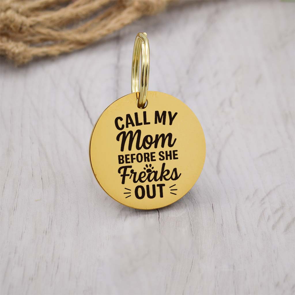 Funny gold pet ID tag with 'Call My Mom Before She Freaks Out' engraved — personalized dog or cat tag for pet safety and identification.