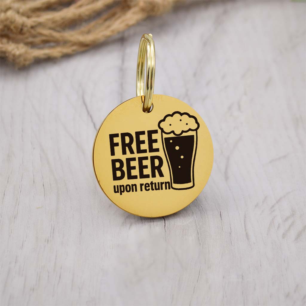 Funny gold pet ID tag with 'Free Beer upon return' engraved — personalized dog or cat tag for pet safety and identification.