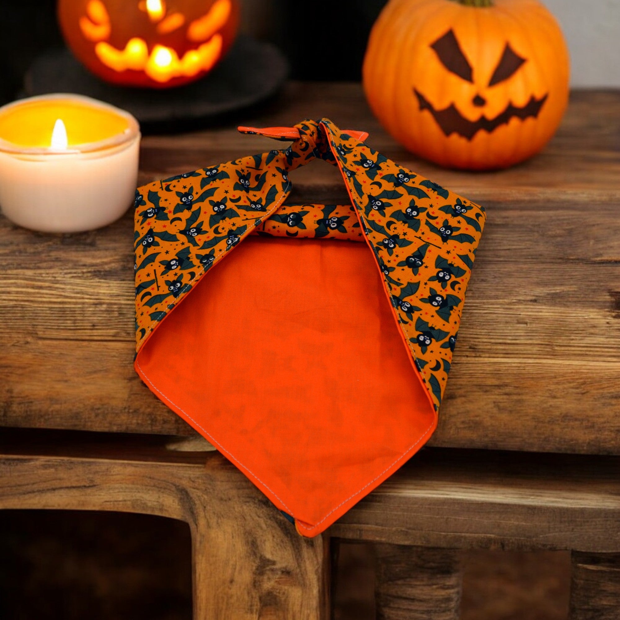 Halloween patterned Dog Bandana on a wooden table