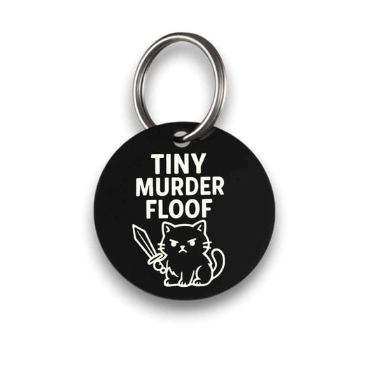 Funny black pet ID tag for dogs and cats with the engraved text 'Tiny Murder Floof' - Tag4MyPet