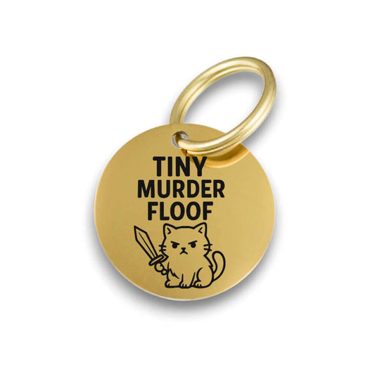 Funny gold pet ID tag for dogs and cats with the engraved text 'Tiny Murder Floof' - Tag4MyPet