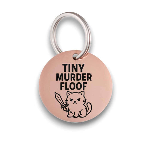 Funny rose gold pet ID tag for dogs and cats with the engraved text 'Tiny Murder Floof' - Tag4MyPet