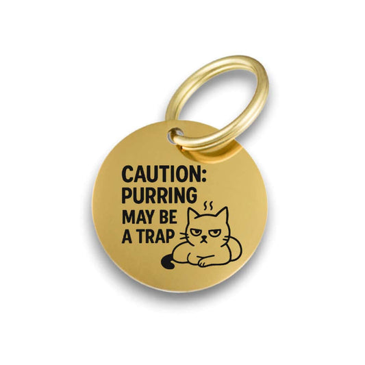 Funny gold pet ID tag for dogs and cats with the engraved text 'Caution:purring may be a trap' - Tag4MyPet