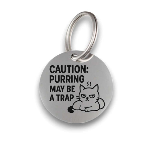 Funny silver pet ID tag for dogs and cats with the engraved text 'Caution:purring may be a trap' - Tag4MyPet