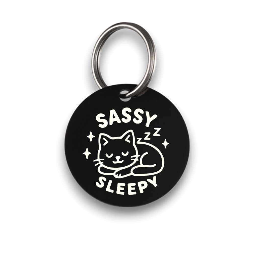 Funny black pet ID tag for dogs and cats with the engraved text 'Sassy Sleepy' - Tag4MyPet