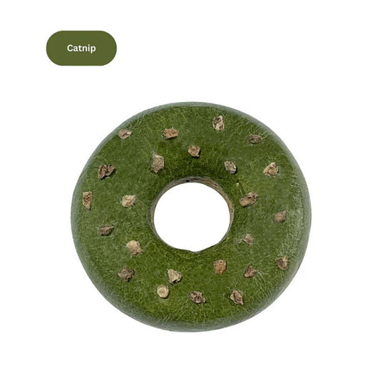 Catnip-flavored donut-shaped cat toy with small textured bits on top.