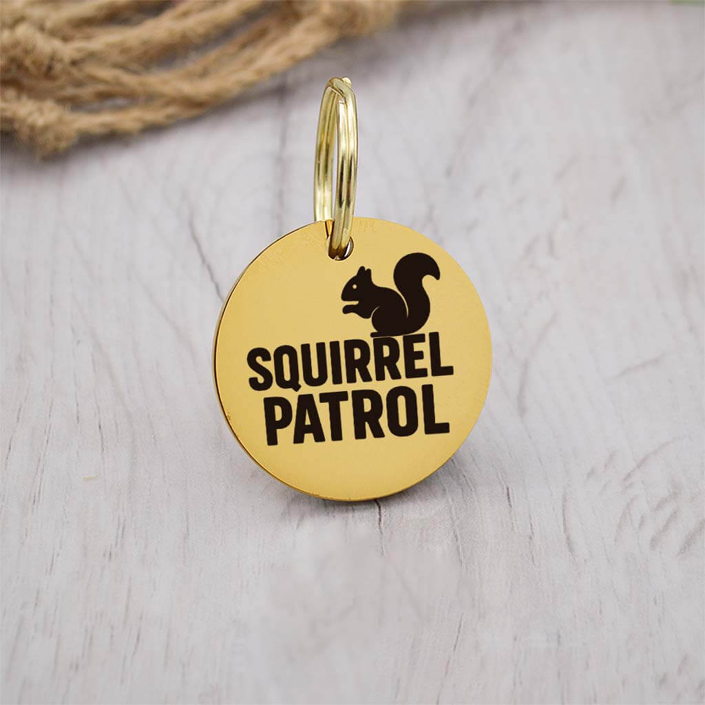 Funny gold pet ID tag with 'Squirrel Patrol' engraved — personalized dog or cat tag for pet safety and identification.