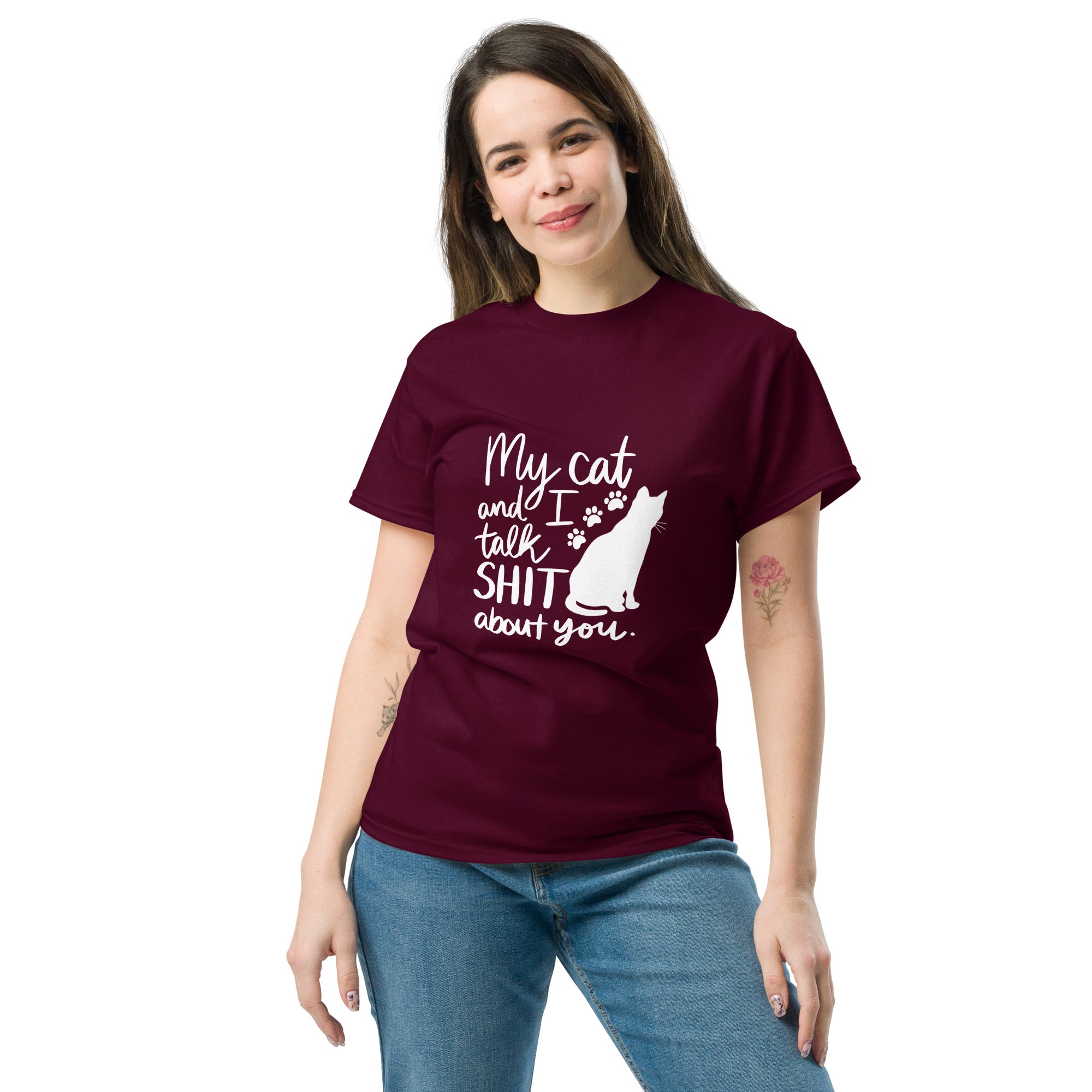 A woman wearing a maroon t-shirt with text "My cat and I talk shit about you" with silhouette of cat and paw prints